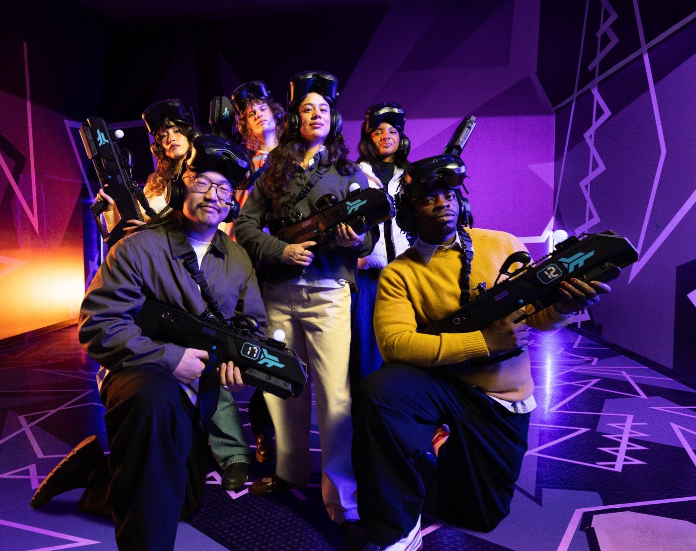 A squad of six celebrating in Zero Latency VR gear